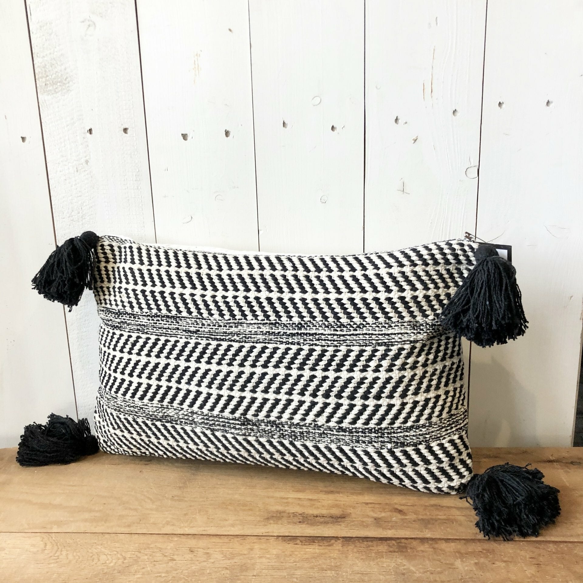 Black striped lumbar pillow with 2024 tassels